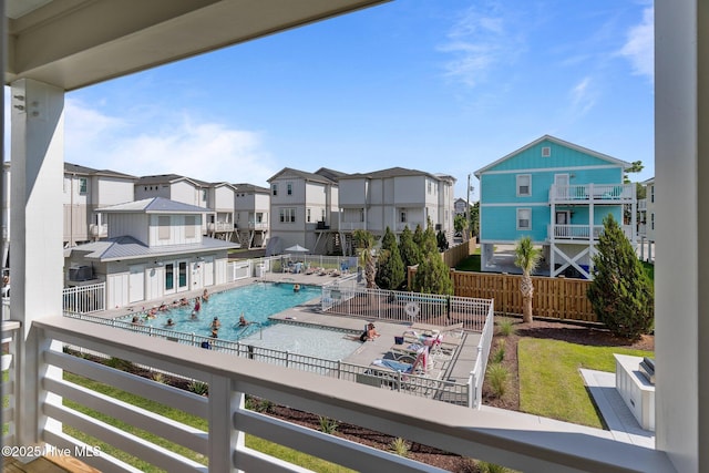 207 Spartanburg Ave Unit 1 & 2, Carolina Beach, NC 28428 - balcony with view of pool and a residential view