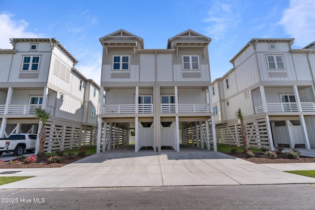 207 Spartanburg Ave Unit 1 & 2, Carolina Beach, NC 28428 - beach home featuring a carport and driveway
