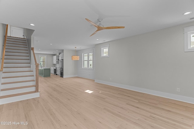 207 Spartanburg Ave Unit 1 & 2, Carolina Beach, NC 28428 - unfurnished living room featuring recessed lighting, ceiling fan, light wood-style flooring, and stairway