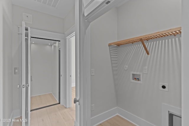 207 Spartanburg Ave Unit 1 & 2, Carolina Beach, NC 28428 - laundry area featuring hookup for an electric dryer, hookup for a washing machine, and light wood-style floors