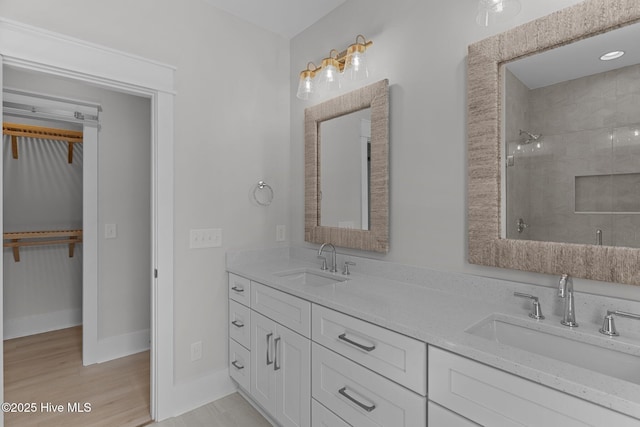 207 Spartanburg Ave Unit 1 & 2, Carolina Beach, NC 28428 - full bathroom with double vanity, a tile shower, and wood finished floors