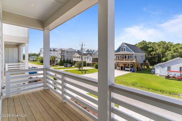 207 Spartanburg Ave Unit 1 & 2, Carolina Beach, NC 28428 - wooden deck with a residential view and a lawn