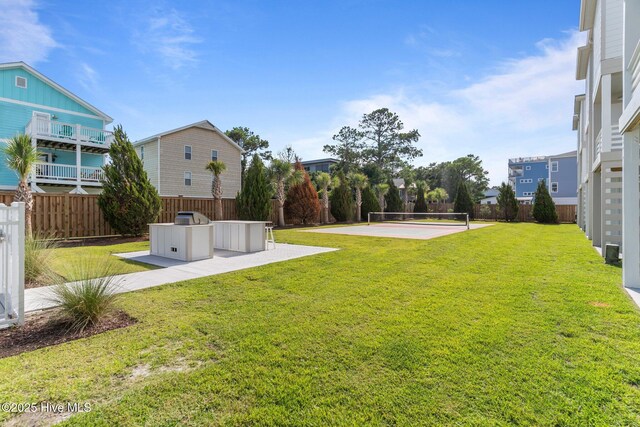 207 Spartanburg Ave Unit 1 & 2, Carolina Beach, NC 28428 - fenced backyard with area for grilling and a patio