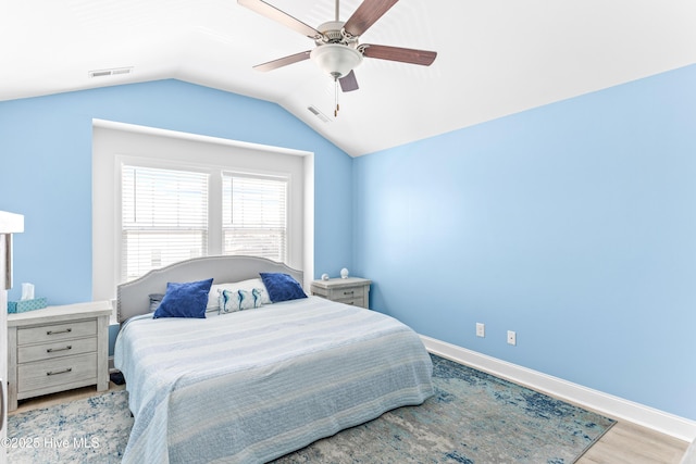 2526 Longleaf Pine Cir, Leland, NC 28451 - bedroom with lofted ceiling, a ceiling fan, and wood finished floors