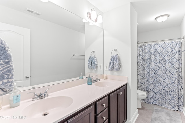 2526 Longleaf Pine Cir, Leland, NC 28451 - bathroom featuring double vanity and toilet