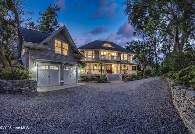 318 Cabbage Inlet Ln, Wilmington, NC 28409 - view of front of home featuring a porch, driveway, a garage, and a shingled roof