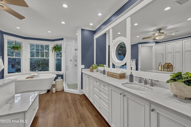 318 Cabbage Inlet Ln, Wilmington, NC 28409 - full bathroom with a ceiling fan, ornamental molding, a shower stall, double vanity, and a freestanding tub