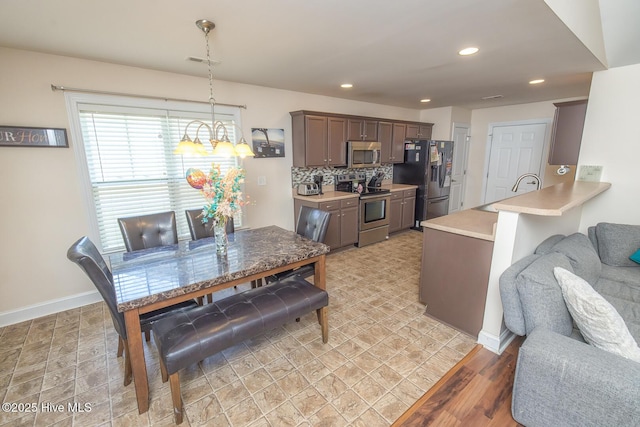 1247 Dunlop Dr NE, Leland, NC 28451 - dining area featuring recessed lighting and a chandelier