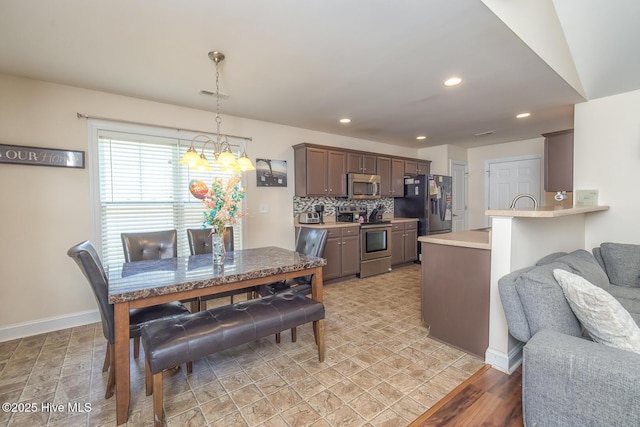 1247 Dunlop Dr NE, Leland, NC 28451 - dining space with a chandelier and recessed lighting