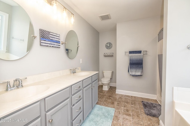 1247 Dunlop Dr NE, Leland, NC 28451 - full bathroom with double vanity, a tub to relax in, stone finish floors, and a shower