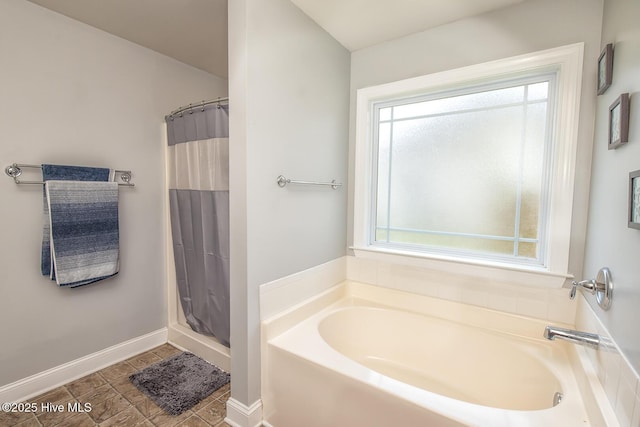 1247 Dunlop Dr NE, Leland, NC 28451 - bathroom featuring a garden tub and a shower with shower curtain