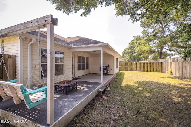 1247 Dunlop Dr NE, Leland, NC 28451 - fenced backyard with a fire pit and a deck
