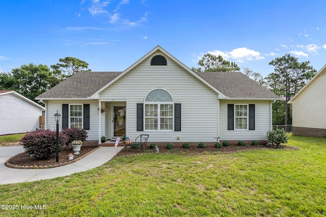 58 Crystal Rd, Southport, NC 28461 - view of front of house with roof with shingles and a front yard