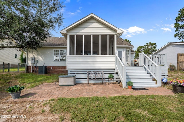 58 Crystal Rd, Southport, NC 28461 - rear view of property with a sunroom, stairs, roof with shingles, and a patio