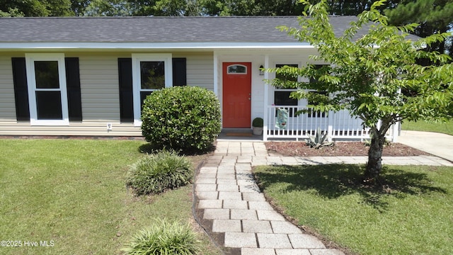 109 Lewis Ct, Havelock, NC 28532 - view of front of home with a porch, a front lawn, and roof with shingles