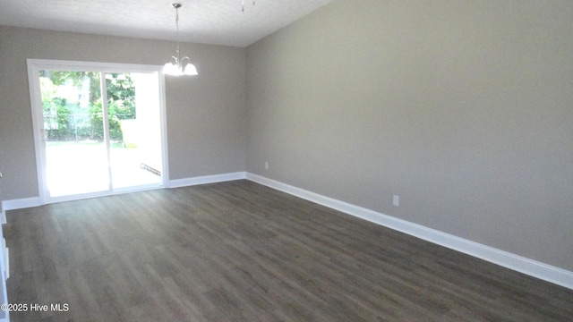 109 Lewis Ct, Havelock, NC 28532 - empty room with a chandelier and dark wood-type flooring