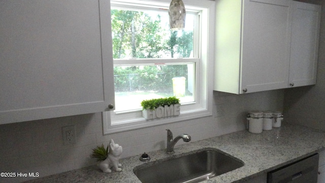 109 Lewis Ct, Havelock, NC 28532 - kitchen featuring dishwashing machine, white cabinets, decorative backsplash, and light stone counters