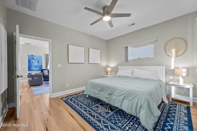 8202 5th Ave, North Topsail Beach, NC 28460 - bedroom with light wood finished floors and a ceiling fan