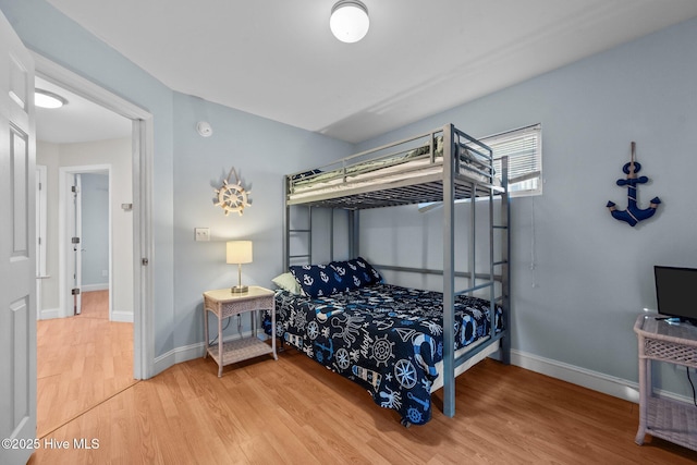 8202 5th Ave, North Topsail Beach, NC 28460 - bedroom with wood finished floors and baseboards