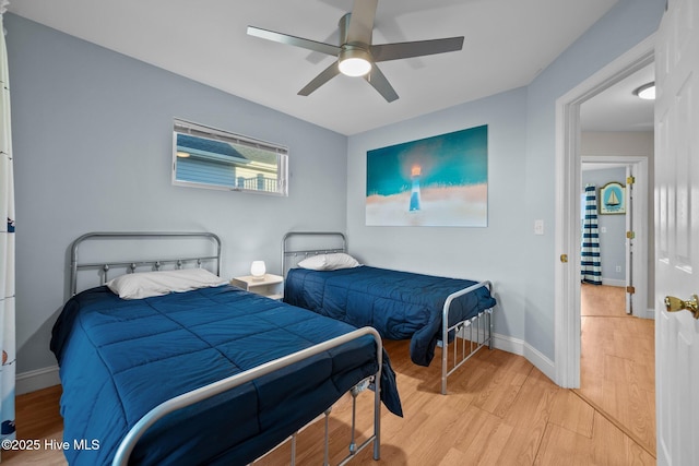 8202 5th Ave, North Topsail Beach, NC 28460 - bedroom featuring light wood finished floors and a ceiling fan