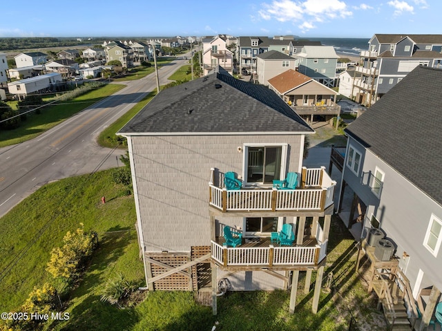 8202 5th Ave, North Topsail Beach, NC 28460 - rear view of property with a shingled roof, a residential view, and a balcony