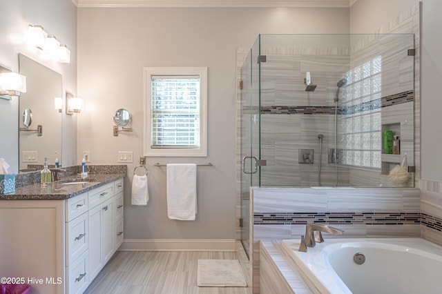 56 Kilbride Dr, Pinehurst, NC 28374 - bathroom with vanity, a garden tub, a shower stall, and ornamental molding