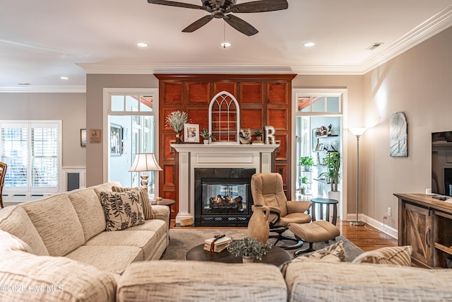 56 Kilbride Dr, Pinehurst, NC 28374 - living area featuring a multi sided fireplace, ceiling fan, recessed lighting, plenty of natural light, and crown molding
