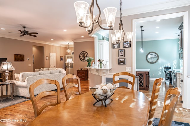 56 Kilbride Dr, Pinehurst, NC 28374 - dining space with wood finished floors, recessed lighting, a chandelier, ceiling fan, and ornamental molding