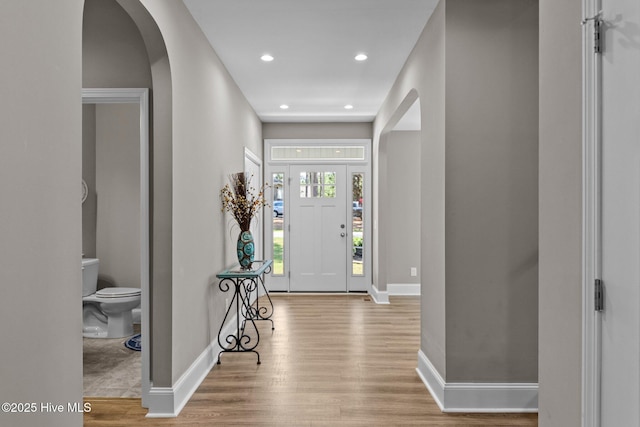 16 Starlit Ln, Pinehurst, NC 28374 - foyer featuring arched walkways, wood finished floors, and recessed lighting