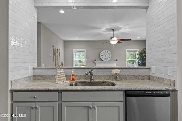 16 Starlit Ln, Pinehurst, NC 28374 - kitchen featuring stainless steel dishwasher, a ceiling fan, gray cabinets, light stone counters, and healthy amount of natural light
