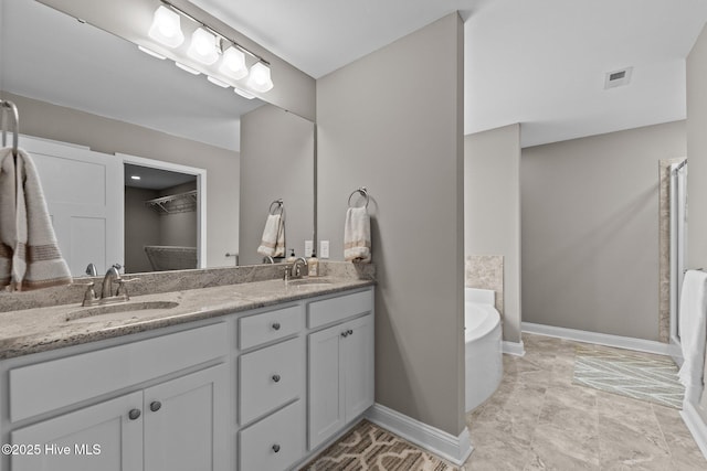 16 Starlit Ln, Pinehurst, NC 28374 - bathroom featuring double vanity and a bath