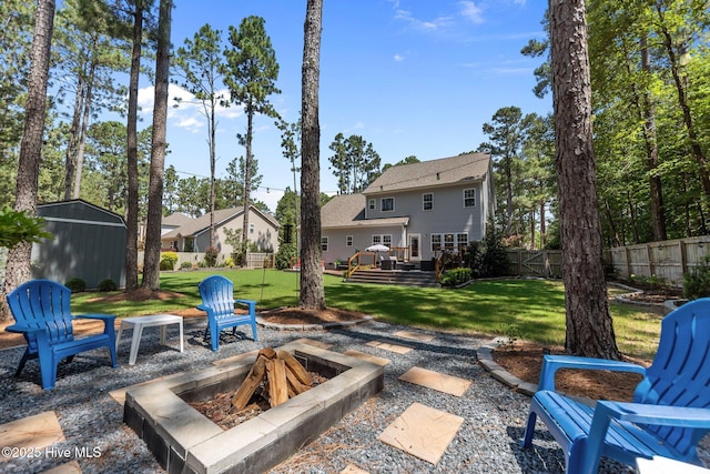 16 Starlit Ln, Pinehurst, NC 28374 - view of patio / terrace featuring an outdoor fire pit, a deck, and a storage unit
