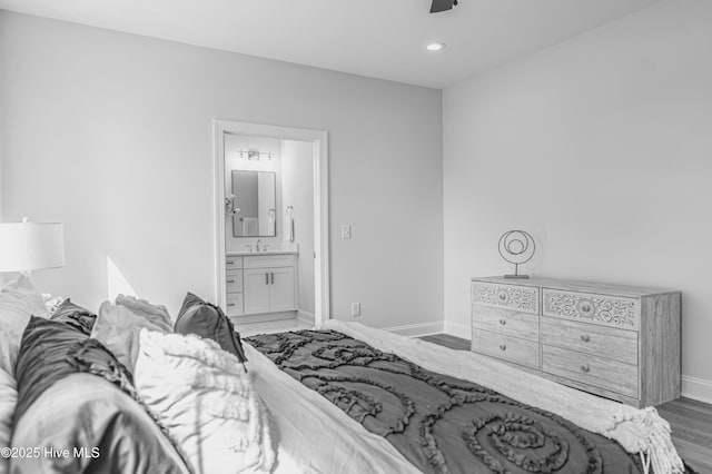 1165 Burning Tree Rd, Pinehurst, NC 28374 - bedroom with ensuite bathroom, recessed lighting, wood finished floors, and ceiling fan