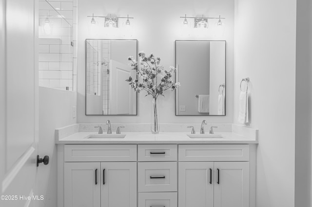1165 Burning Tree Rd, Pinehurst, NC 28374 - bathroom featuring double vanity and a tile shower
