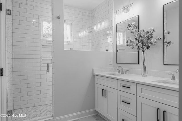 1165 Burning Tree Rd, Pinehurst, NC 28374 - bathroom featuring marble look tiles, a shower stall, and double vanity