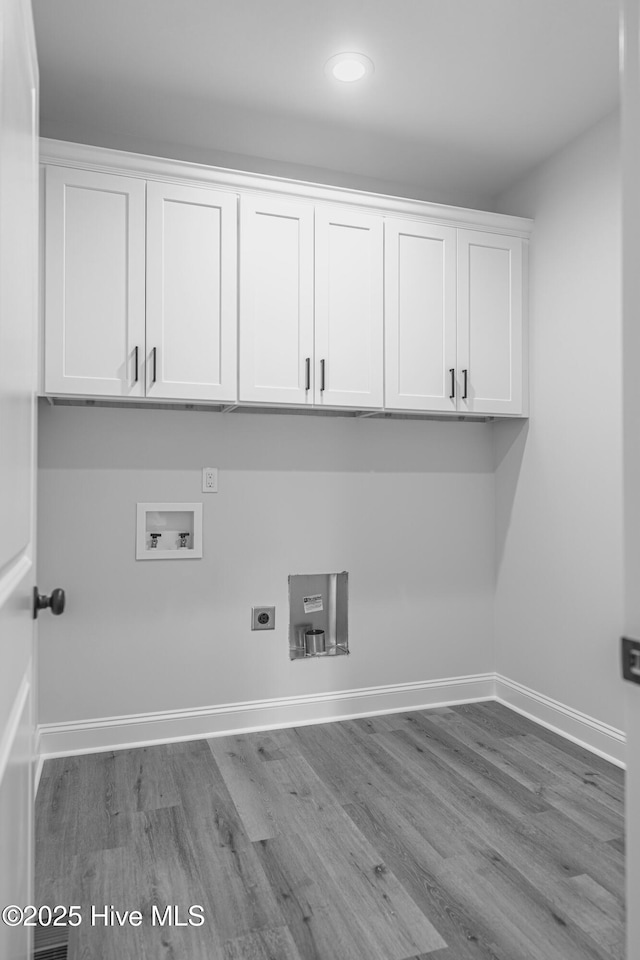 1165 Burning Tree Rd, Pinehurst, NC 28374 - laundry room with cabinet space, hookup for a washing machine, hookup for an electric dryer, wood finished floors, and recessed lighting