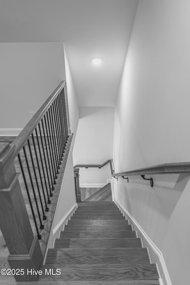 1165 Burning Tree Rd, Pinehurst, NC 28374 - stairway with baseboards and wood finished floors