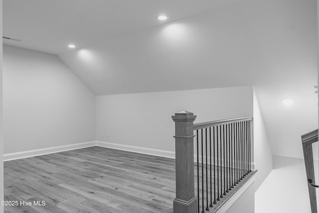 1165 Burning Tree Rd, Pinehurst, NC 28374 - bonus room with vaulted ceiling, recessed lighting, and wood finished floors
