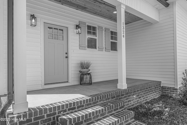 1165 Burning Tree Rd, Pinehurst, NC 28374 - doorway to property featuring covered porch