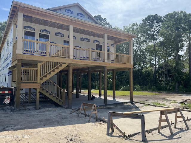 8238 Old Georgetown Rd SW, Sunset Beach, NC 28468 - rear view of property with a carport and stairs