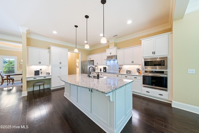 2675 Four Oak Rd, Southport, NC 28461 - kitchen featuring stainless steel appliances, under cabinet range hood, white cabinets, backsplash, and crown molding