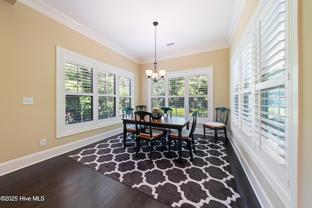 2675 Four Oak Rd, Southport, NC 28461 - dining area with dark wood-style floors, a chandelier, and ornamental molding