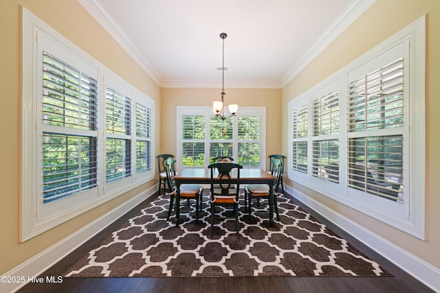 2675 Four Oak Rd, Southport, NC 28461 - dining area with a chandelier, crown molding, and wood finished floors