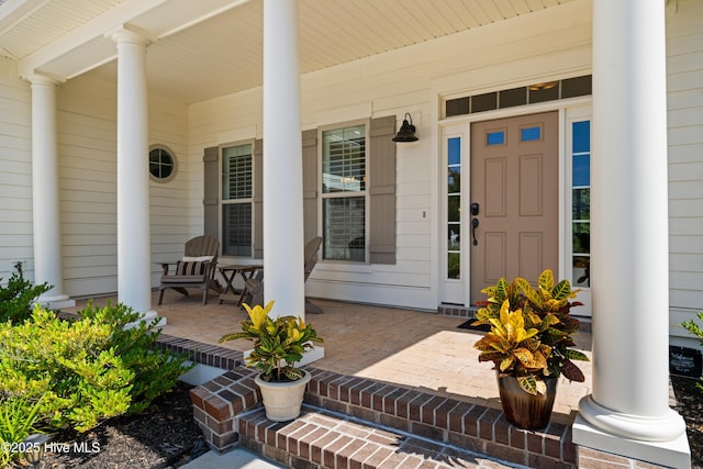 2675 Four Oak Rd, Southport, NC 28461 - doorway to property with a porch