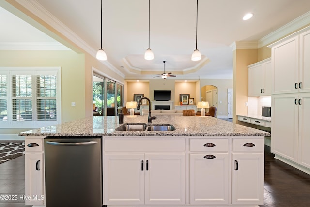 2675 Four Oak Rd, Southport, NC 28461 - kitchen featuring stainless steel dishwasher, a ceiling fan, crown molding, light stone countertops, and white cabinets