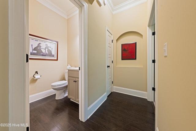 2675 Four Oak Rd, Southport, NC 28461 - half bath featuring ornamental molding, vanity, and wood finished floors