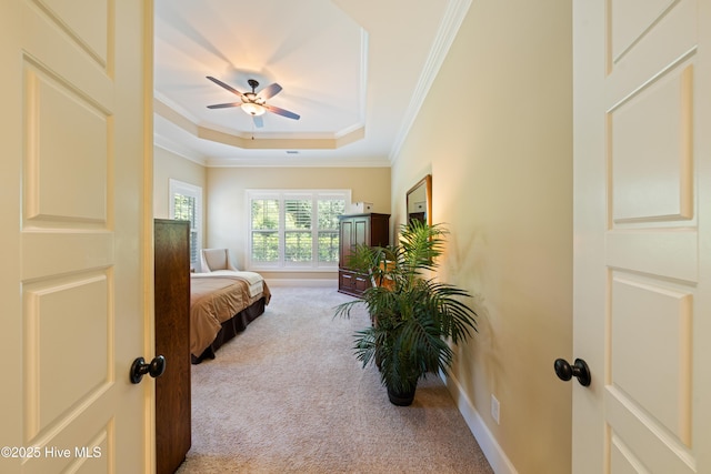 2675 Four Oak Rd, Southport, NC 28461 - bedroom featuring carpet floors, ornamental molding, a raised ceiling, and a ceiling fan