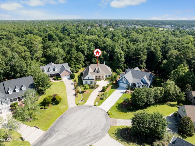 2675 Four Oak Rd, Southport, NC 28461 - aerial view of residential area featuring a heavily wooded area