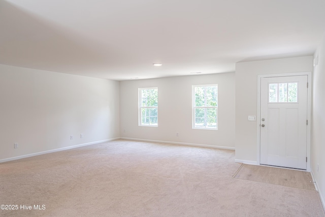 481 Peggy Mill Rd, Hamlet, NC 28345 - foyer entrance with light colored carpet and baseboards