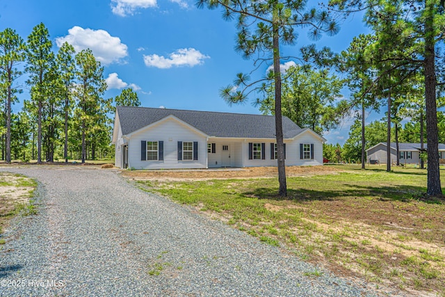481 Peggy Mill Rd, Hamlet, NC 28345 - ranch-style house with gravel driveway and a front yard
